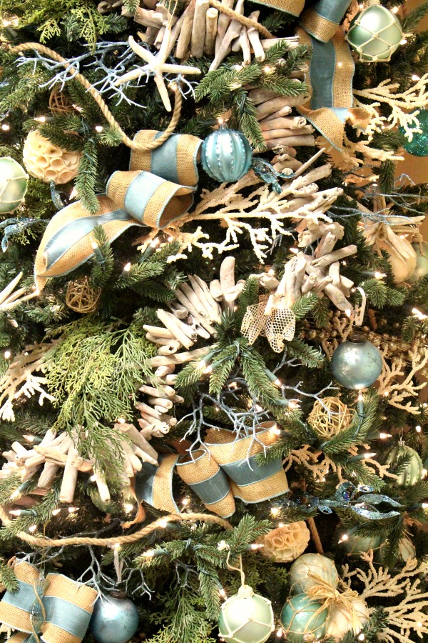 Coastal Christmas tree done in gorgeous blue, green and natural elements. jennelyinteriors.com