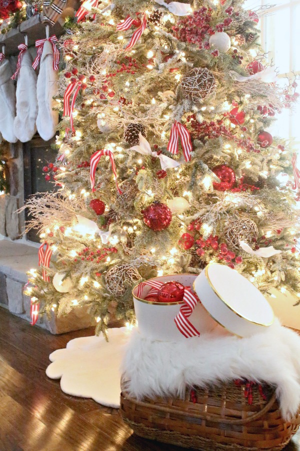 Red and white ornaments adorn this Balsam Hill tree- jennelyinteriors.com