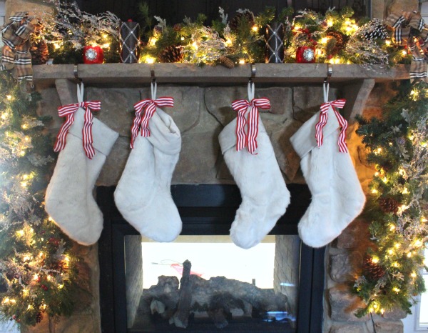 Adding stockings to your mantel gives it a personal touch. jennelyinteriors.com