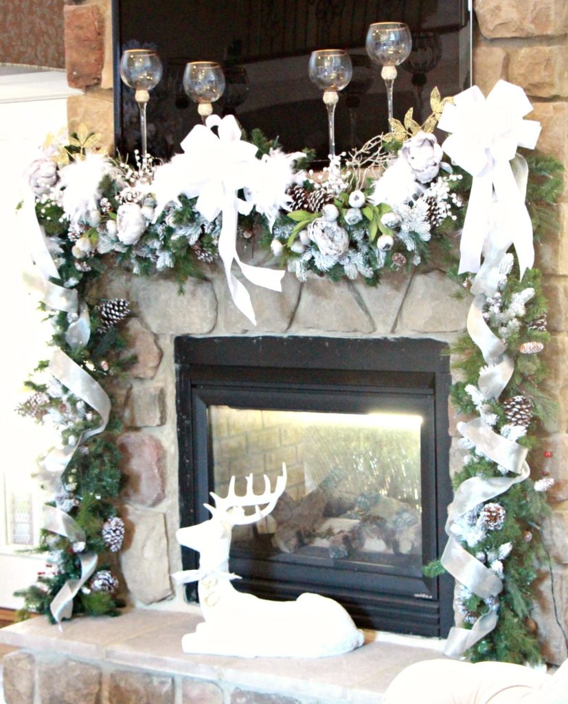 This is my favorite mantel to date. It is very full, but love the finished look with the gray peonies and the big white bows.