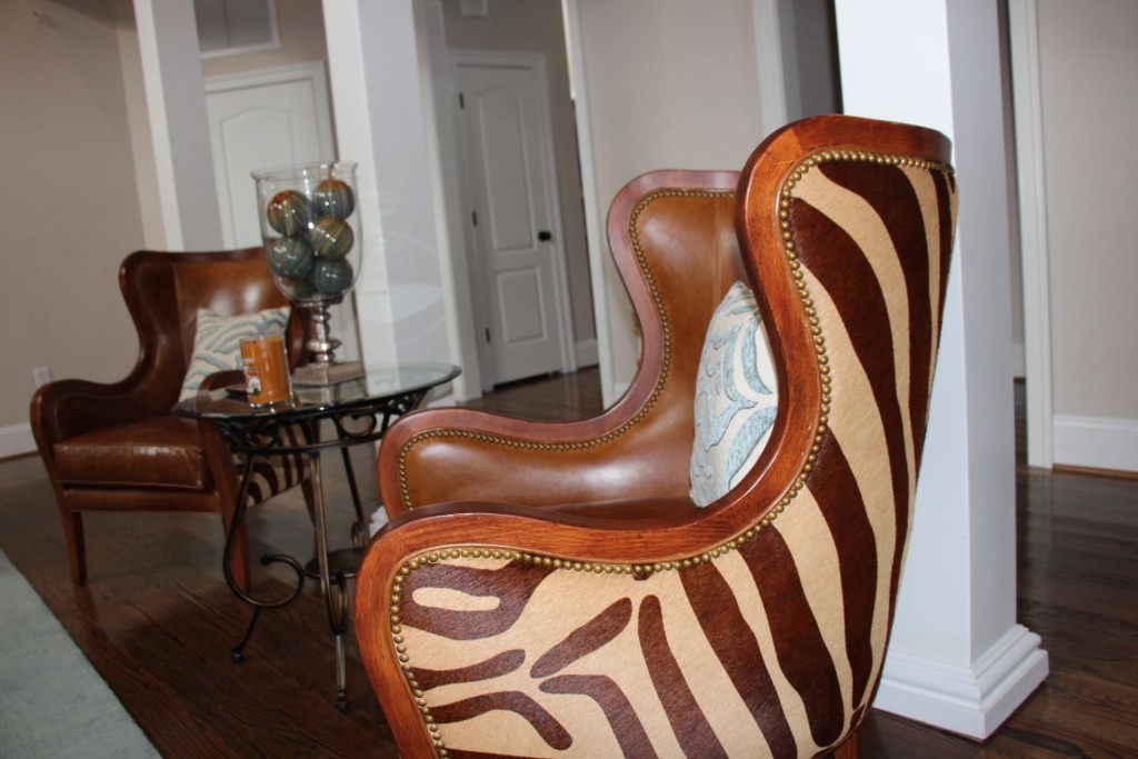 Leather and animal hair chair gives such a masculine feel. www.jennelyinteriors.com