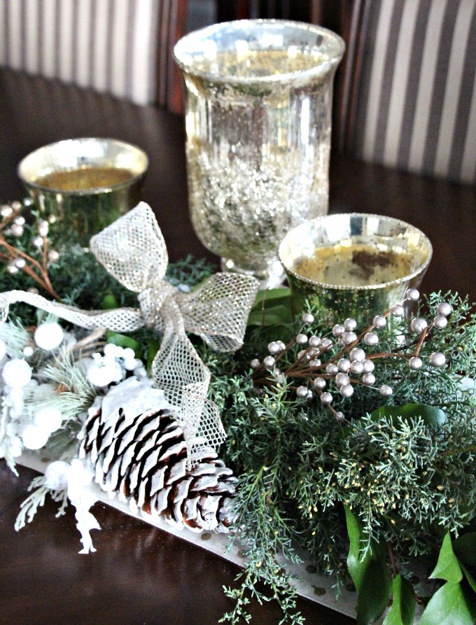 Candles and gold accents were used to finish the dining room table.