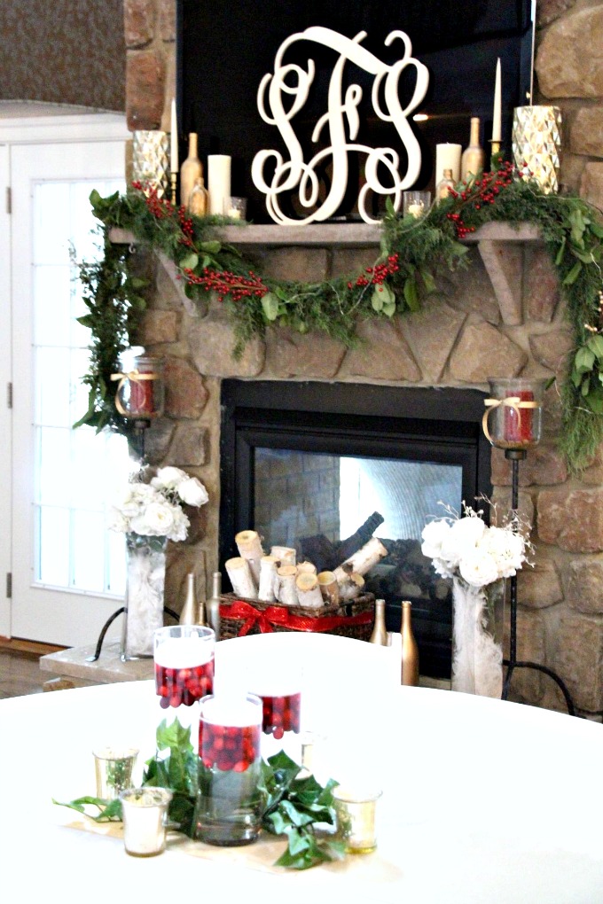 The beautiful table centerpiece goes perfectly with the mantel design. I love how this wedding reception uses tons of candles.