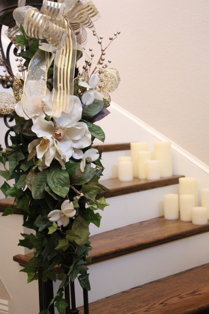 Ivy and candles adorn this staircase to welcome guests as they enter the reception.