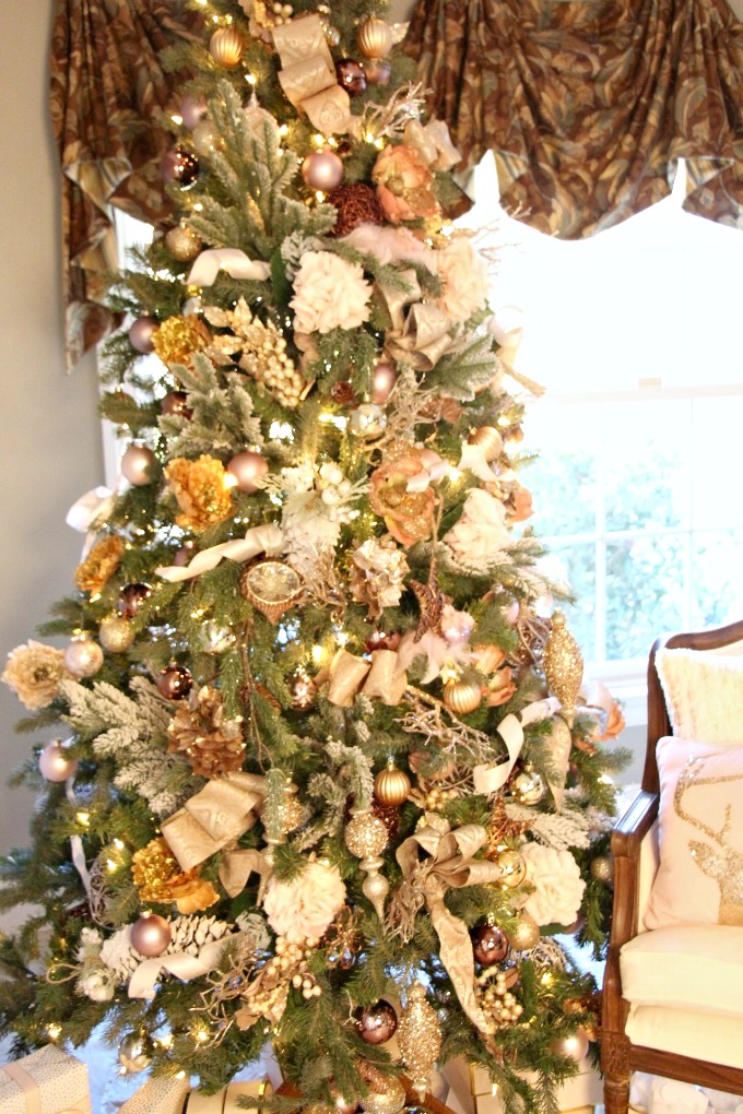 This 7 1/2 foot tree is accented with mixed metallics and blush ornaments.
