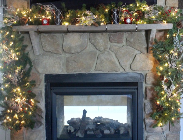 Decorating your mantel in the same colors as your theme will give your home a cohesive look. www.jennelyinteriors.com