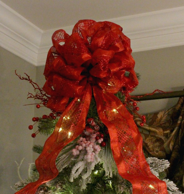 Put the tree topper on before your ornaments. jennelyinteriors.com