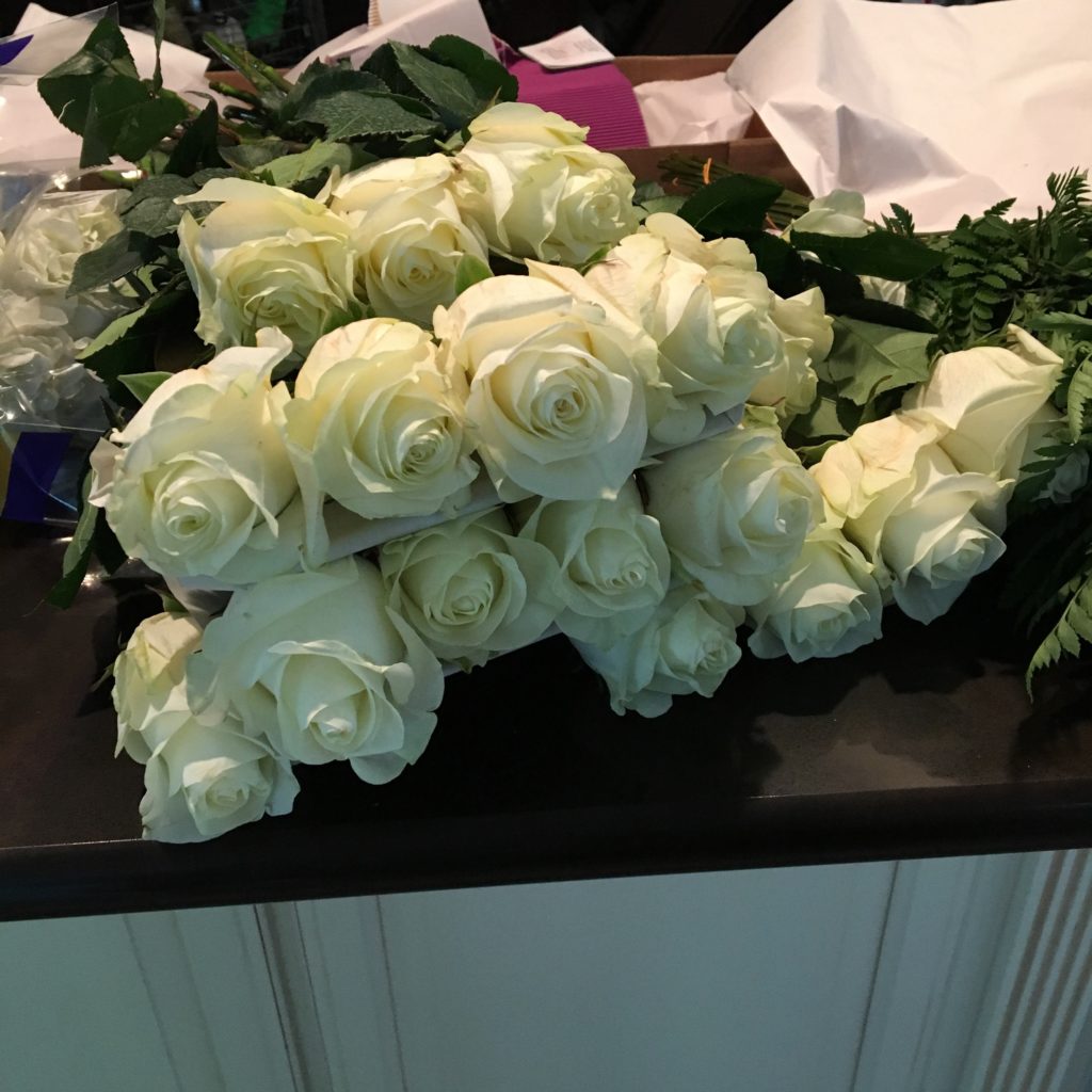 Gorgeous white flowers for a high school graduation party.