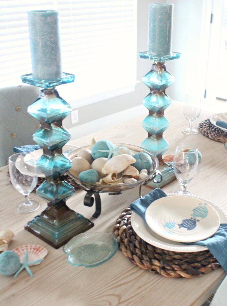 Blue and white dinnerware give this tablescape a beach vibe. 