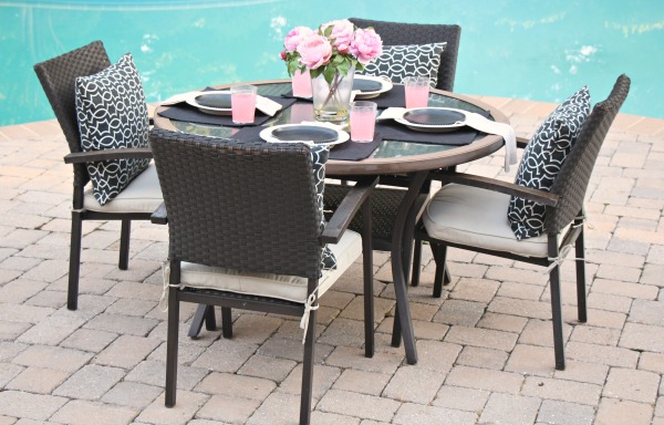 This table is ready for backyard entertaining by the pool.