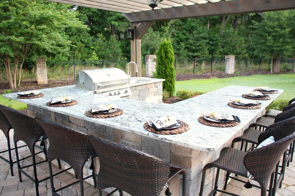 Modern black and white backyard oasis with Frontgate chaise lounges. Yourstrulyjenn