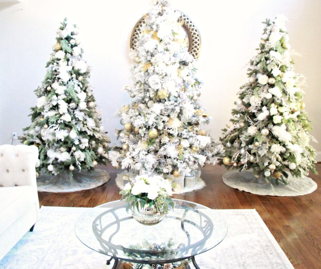 3 stunning Christmas trees done in white, gold and silver for a Winter Wonderland glam look. Jenn Ely Interiors