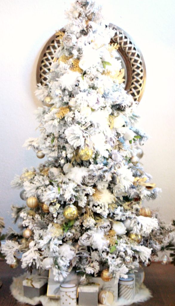 Silver and gold flocked tree for the winter wonderland Holiday House tour.